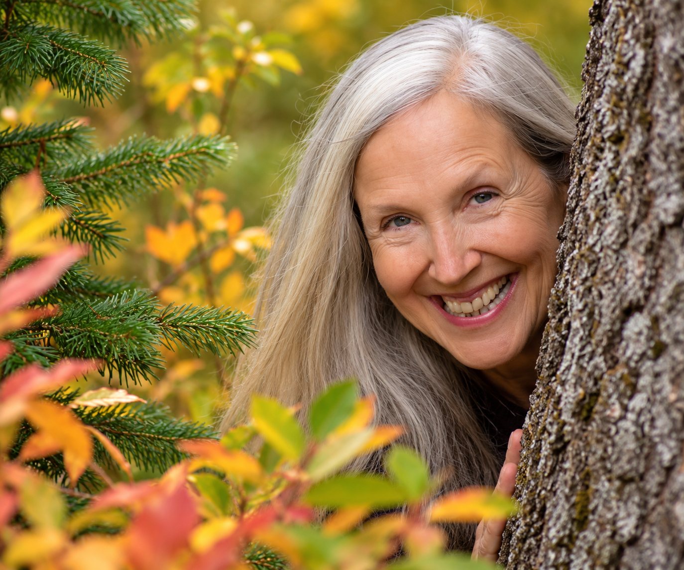 Lynetta Avery smiling among autumn leaves