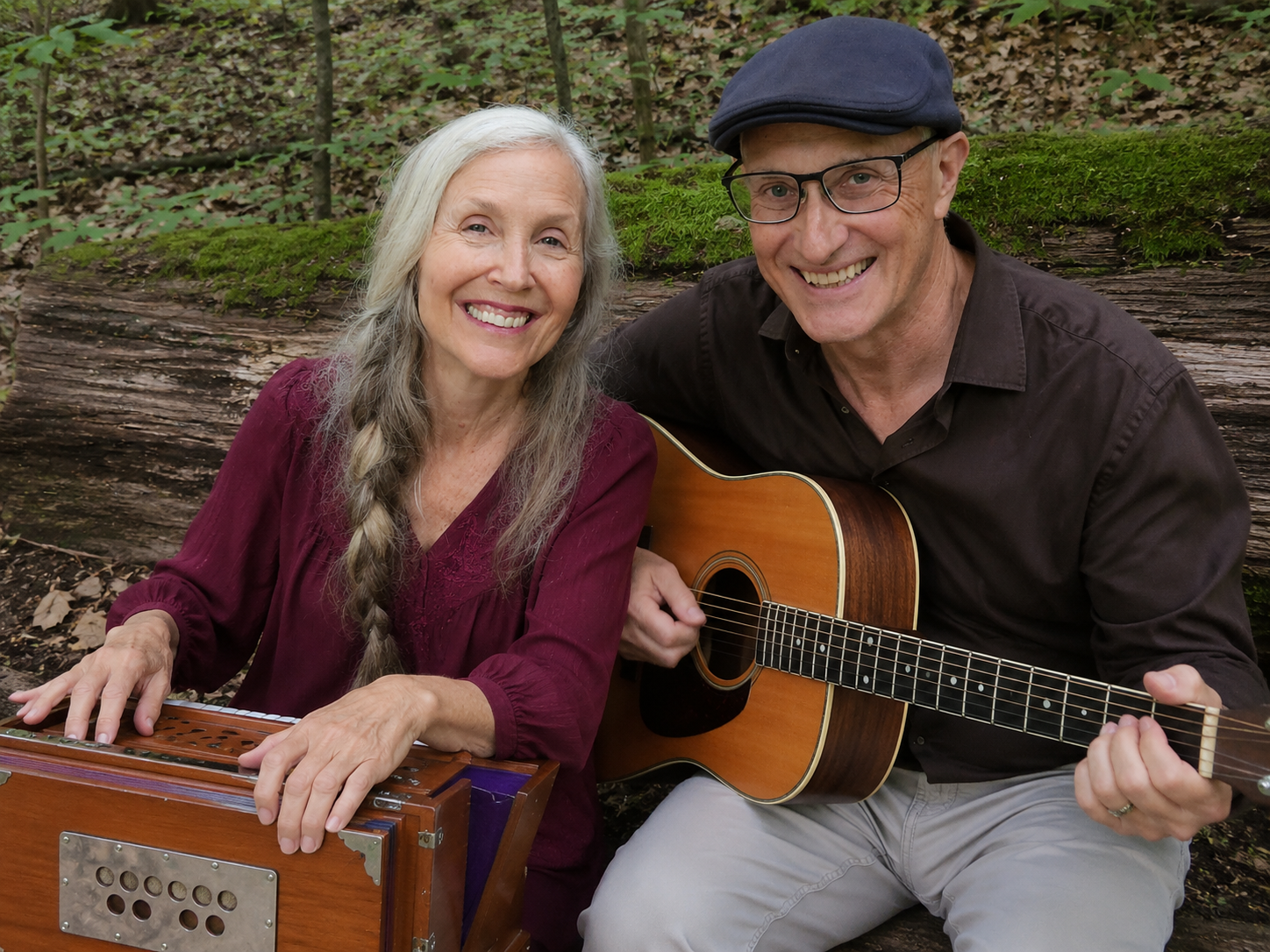 Mark and Lynetta with guitar and Shruti box in the forest
