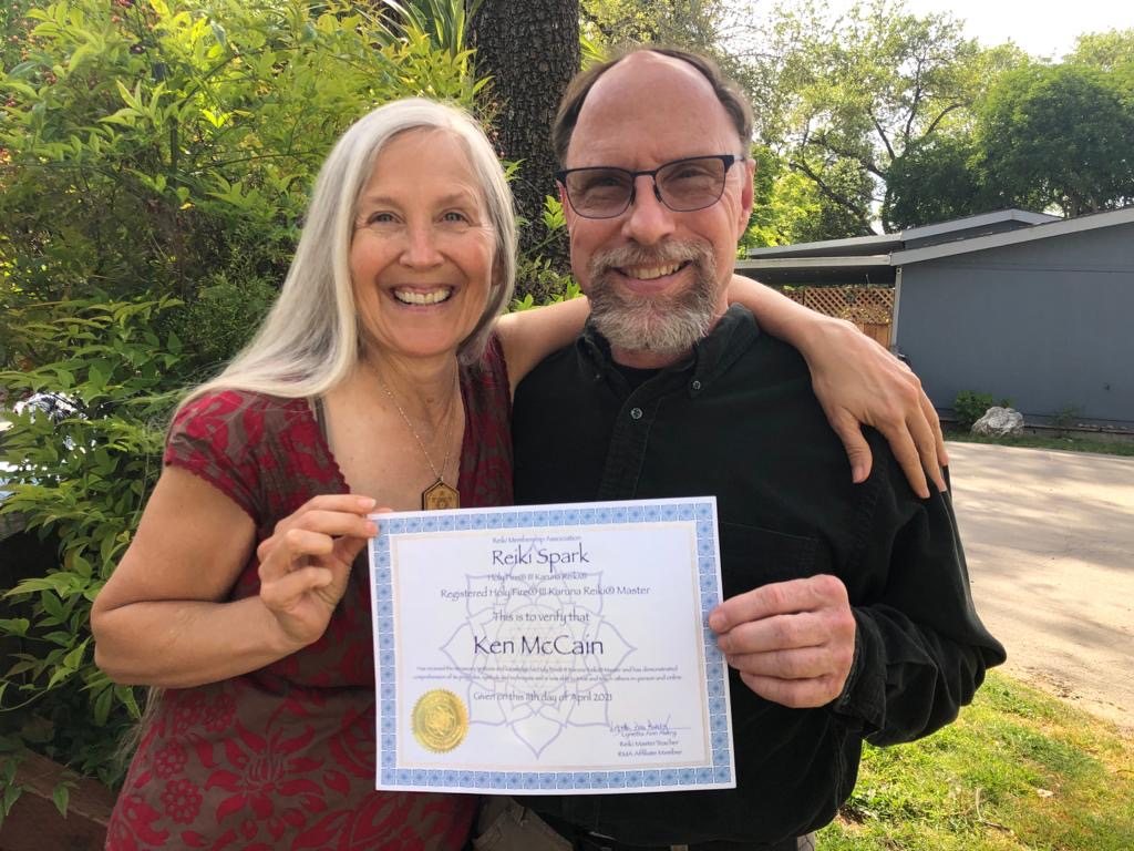 Lynetta with Ken McCain holding his Karuna Reiki Master certificate